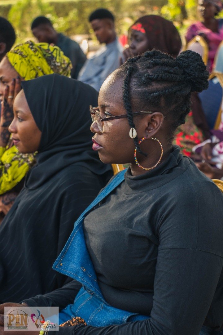Audience member listening at Open Mic Maiduguri