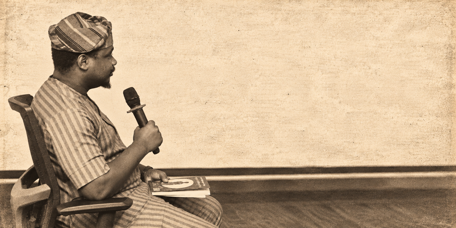 Vic’Adex speaking during a recorded public conversation, rendered in an archival newsprint style
